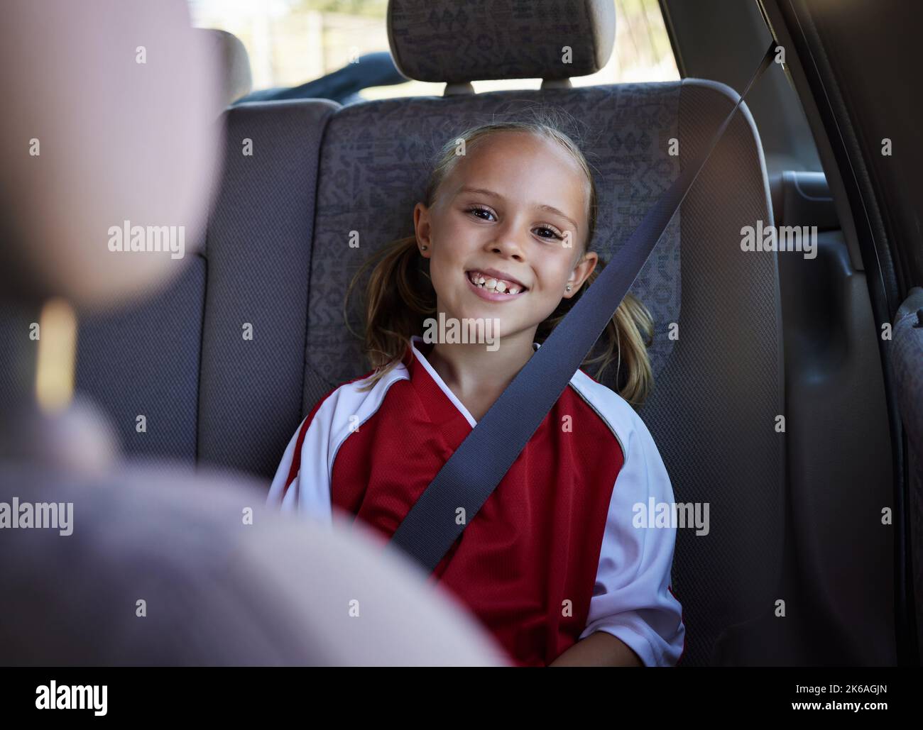 Soccer, travel and girl in a car with a happy, excited and big smile