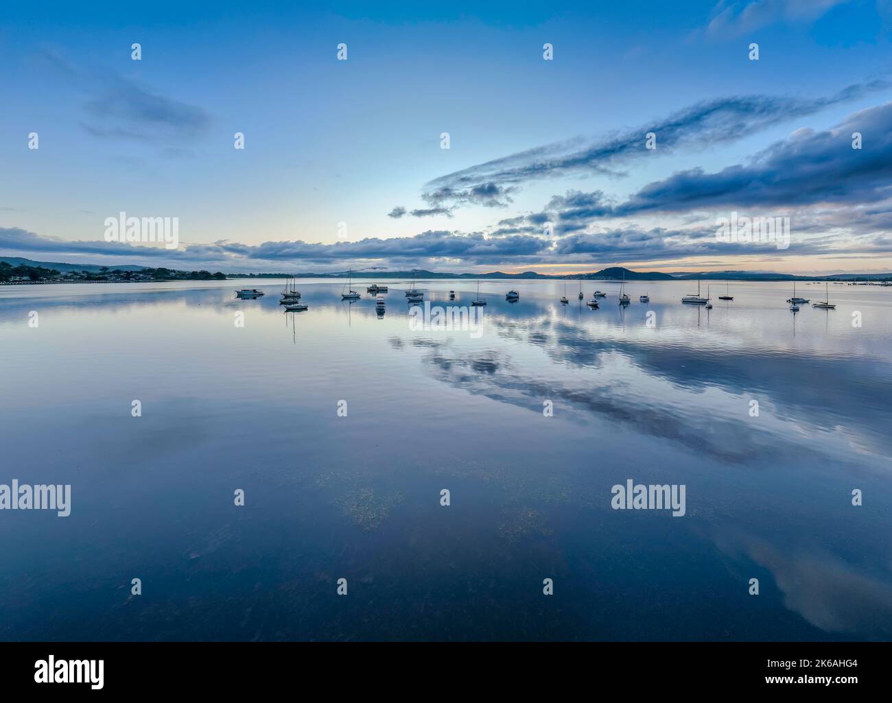 Sunrise reflections over Brisbane Water at Koolewong and Tascott on the Central Coast, NSW, Australia. Stock Photo