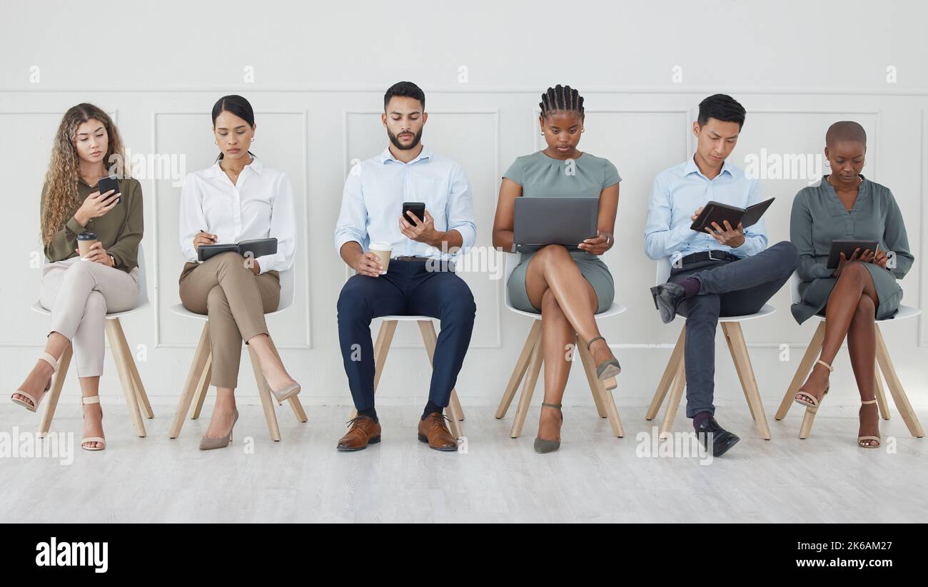 Business people, diversity and waiting room in networking or social media at the office with technology in the workplace. Diverse group of creative Stock Photo