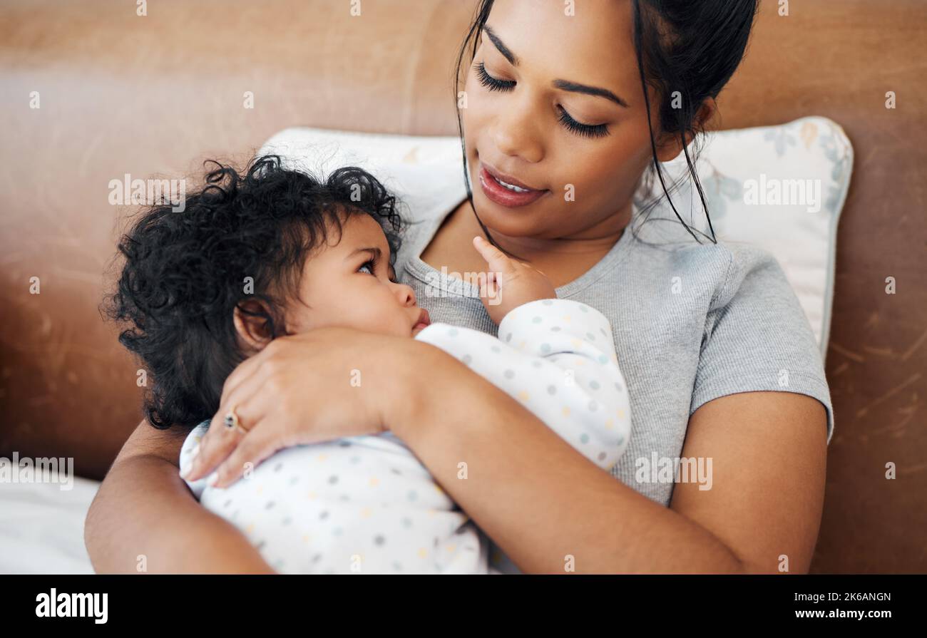 Showing you how much i love you. a mother snuggling her baby girl. Stock Photo