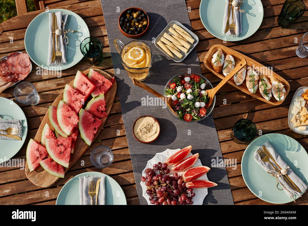 Top view background of wooden dinner table set for Summer party