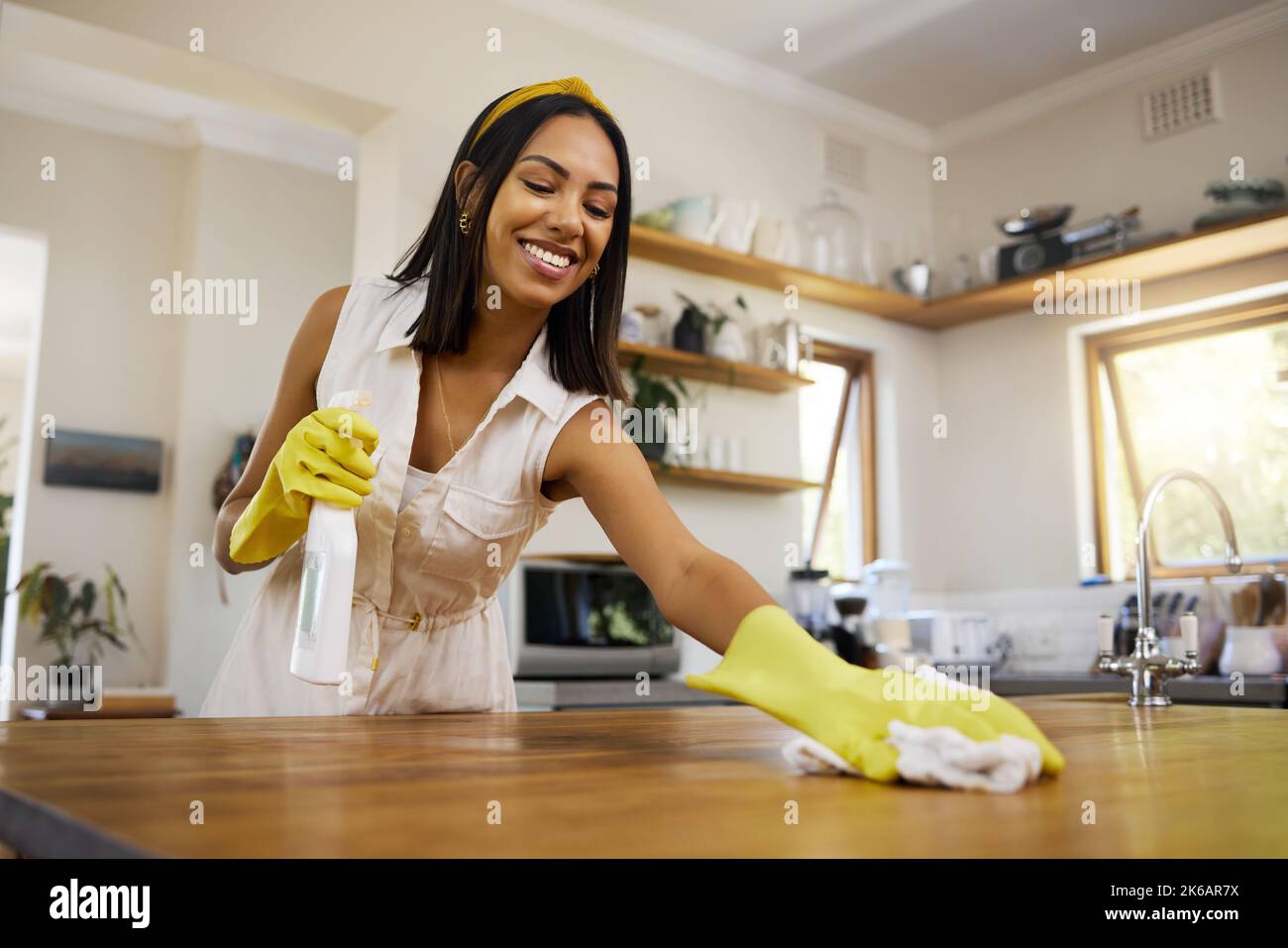 Home cleaning, black woman and kitchen counter with housekeeper with