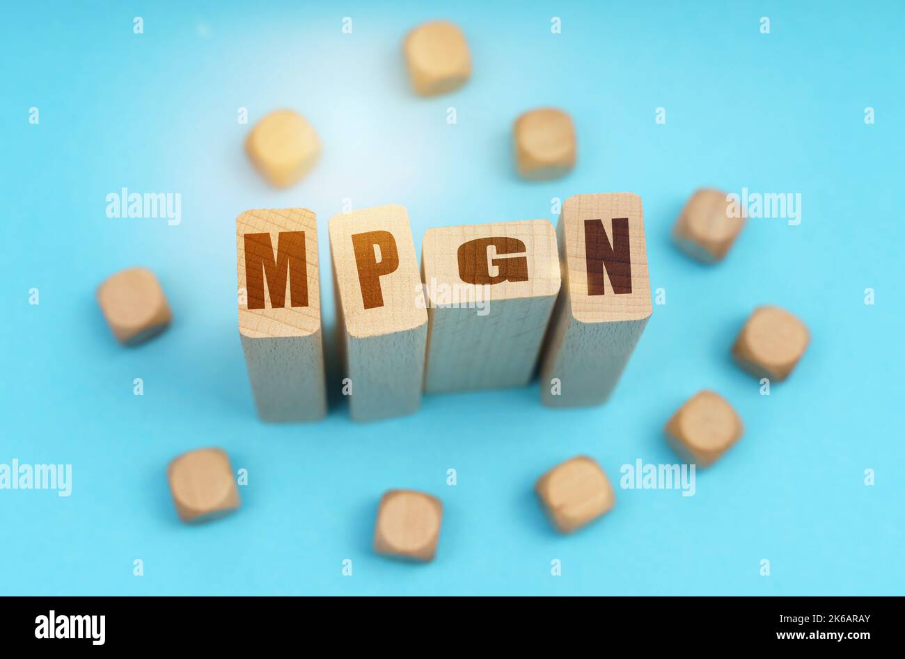 Medicine concept. On a blue background, wooden cubes and Jenga with the inscription - MPGN Stock Photo