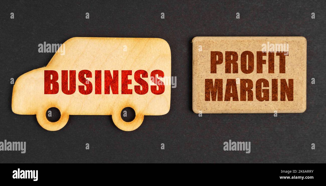 Business concept. On a black background, a car business and a sign