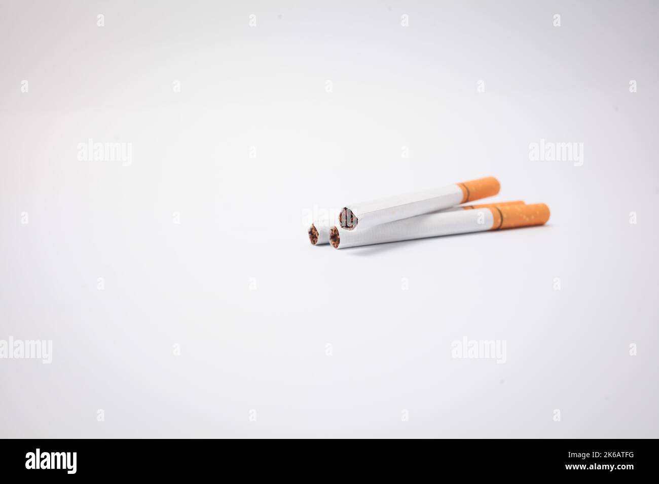 Close up of a smoking cigarettes. Cigarette filter tubes Stock Photo