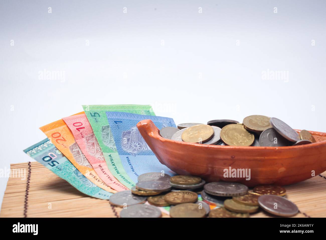 Malaysia Ringgit note and coins isolated on white background. Business ...