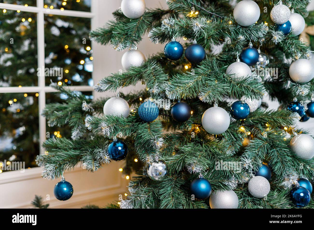 Christmas tree with blue and silver toys. Festively decorated Christmas ...