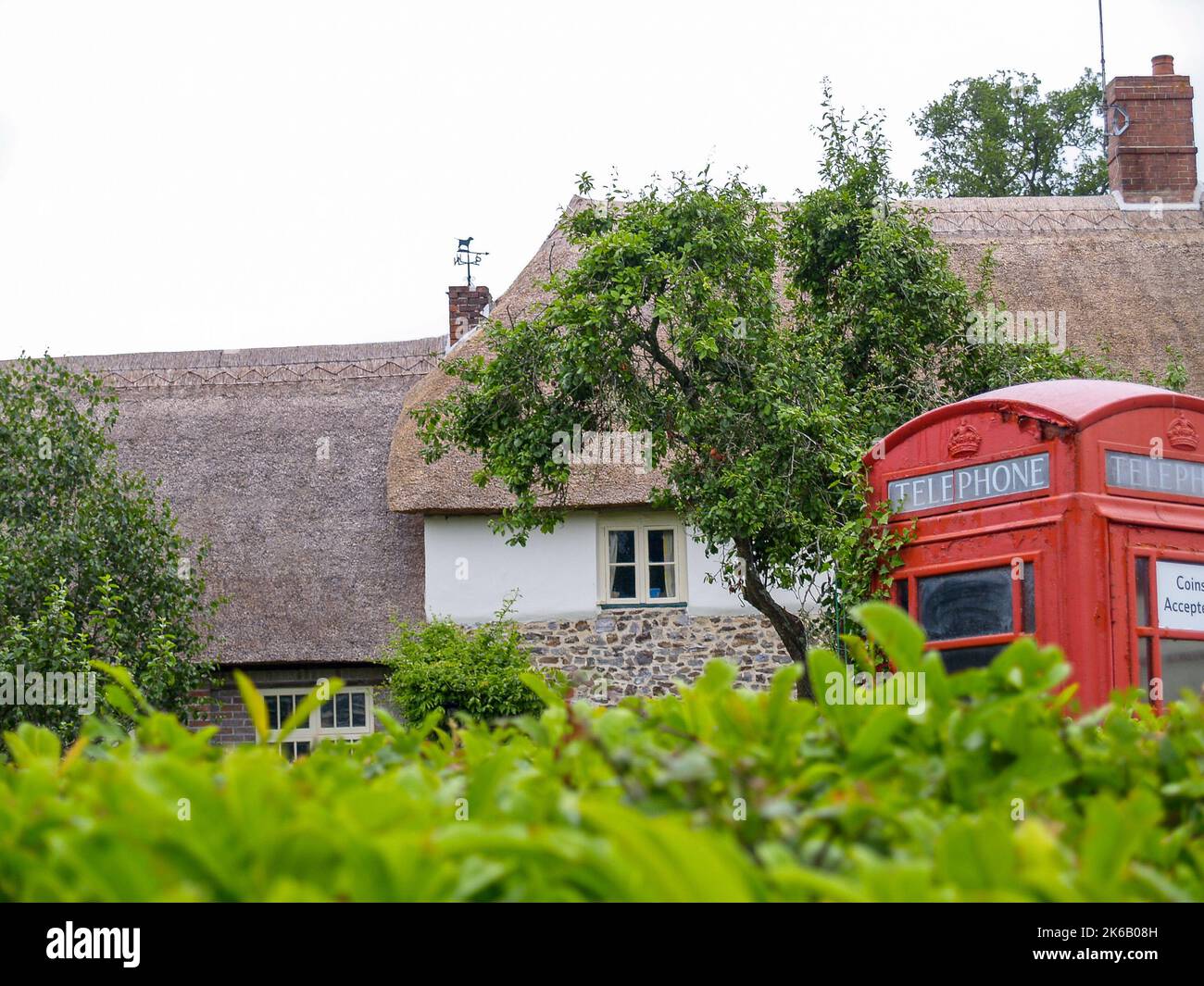 traditional red telephone booth in small English village in UK. Stock Photo
