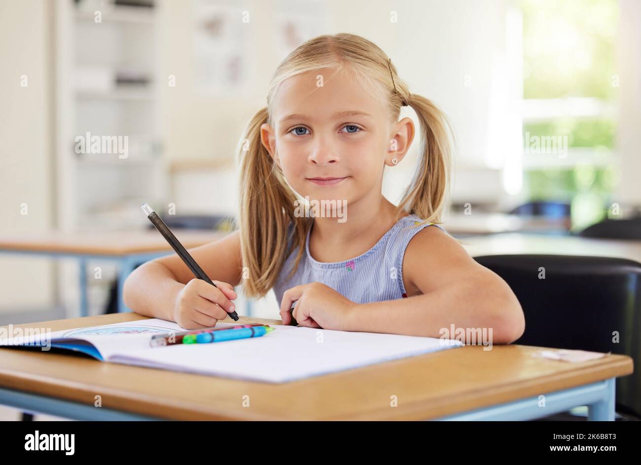 Preschool is an opportunity for growth. a preschooler colouring in class. Stock Photo