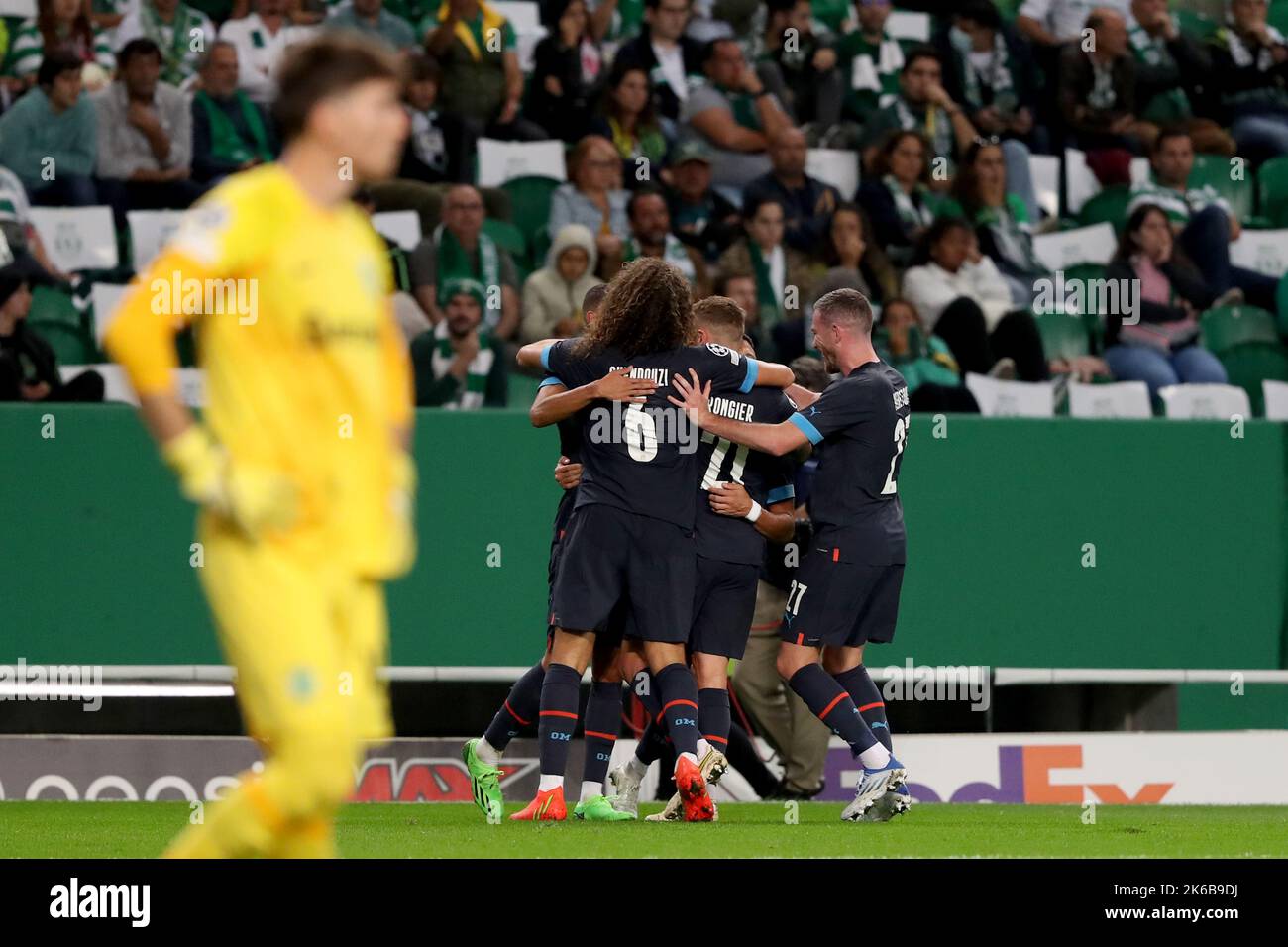 Lisbon, Portugal. 12th Oct, 2022. Players of Marseille (back) celebrate their goal during the UEFA Champions League Group D match between Sporting CP and Olympique de Marseille in Lisbon, Portugal, on Oct. 12, 2022. Credit: Pedro Fiuza/Xinhua/Alamy Live News Stock Photo