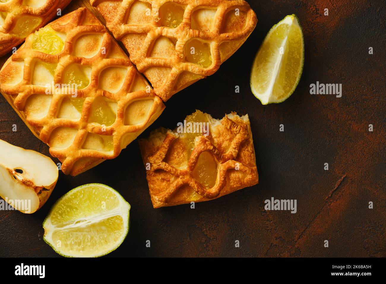 Fresh puff pastry mini pies with pear and lime jam Stock Photo