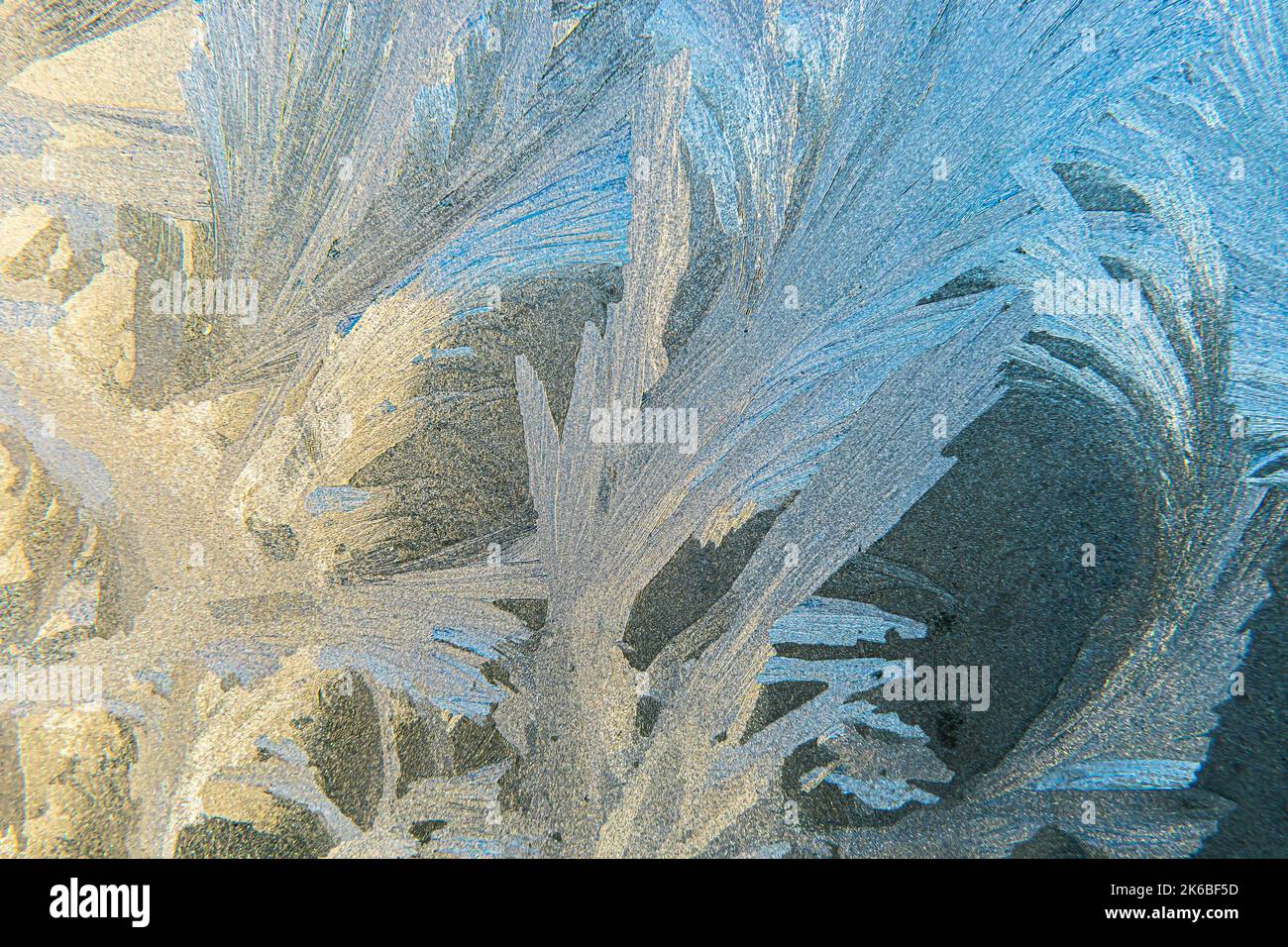 Frozen winter window with shiny ice frost pattern texture. Christmas ...