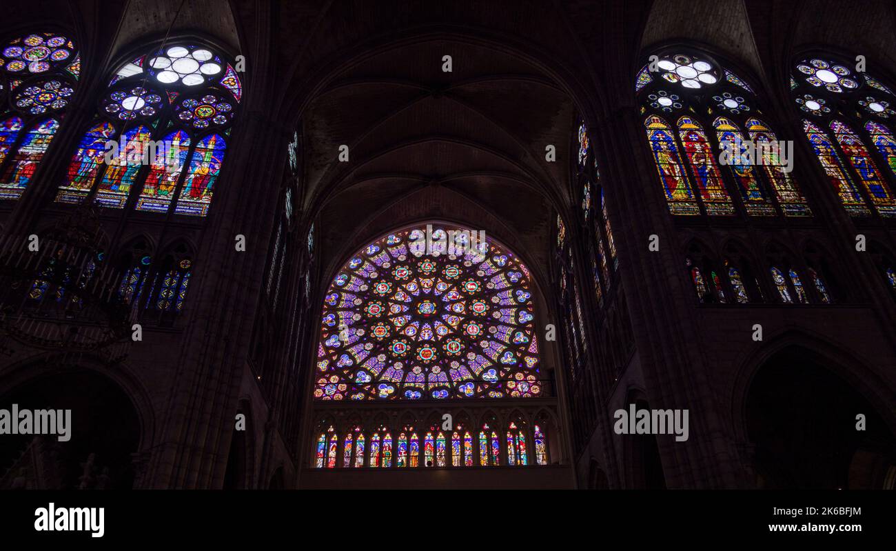 stained glass of rose window of south transept and neighboring windows 13th century, Saint-Denis basilica, Paris, France Stock Photo