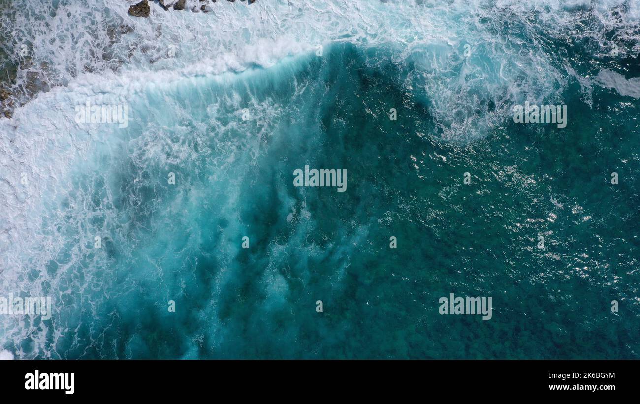 An aerial view of the beautiful blue splashing sea waves Stock Photo ...