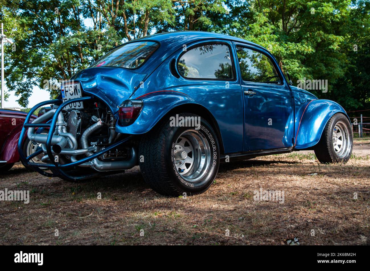 A blue Volkswagen Beetle car parked outdoors Stock Photo