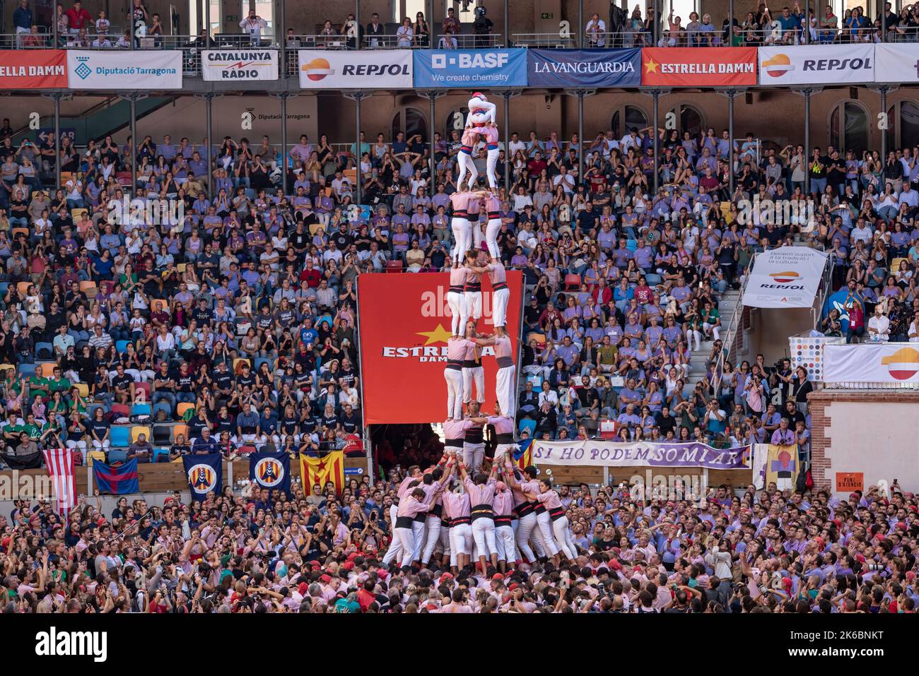 Concurs de Castells de Tarragona 2022 (Tarragona Castells contest). Sunday contest. 3 de 9 amb folre of the Xiquets de Tarragona (Catalonia, Spain) Stock Photo
