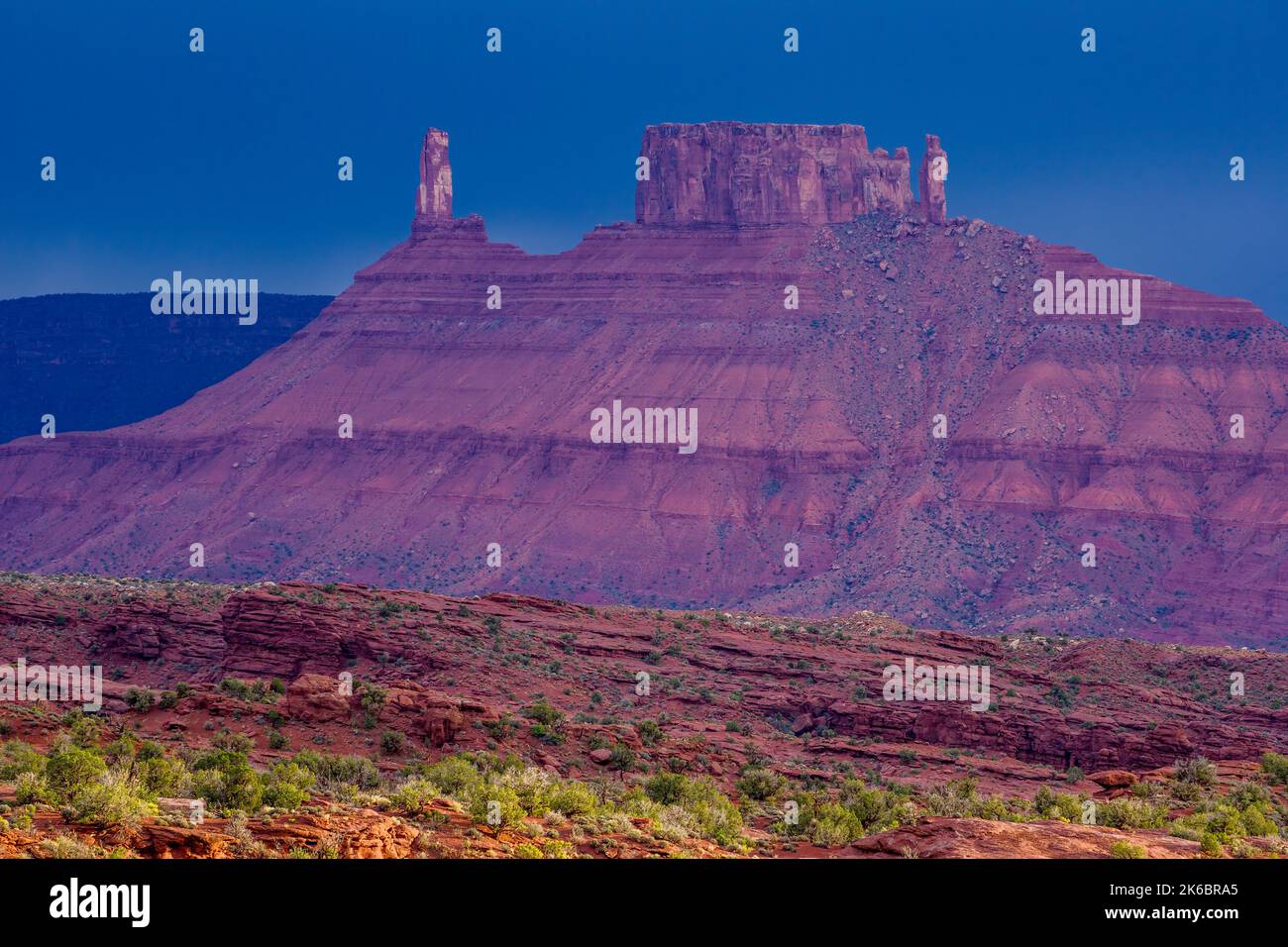 Storm light on Castle Rock / Castleton Tower and the Richardson Amphitheater at dusk near Moab, Utah. Stock Photo