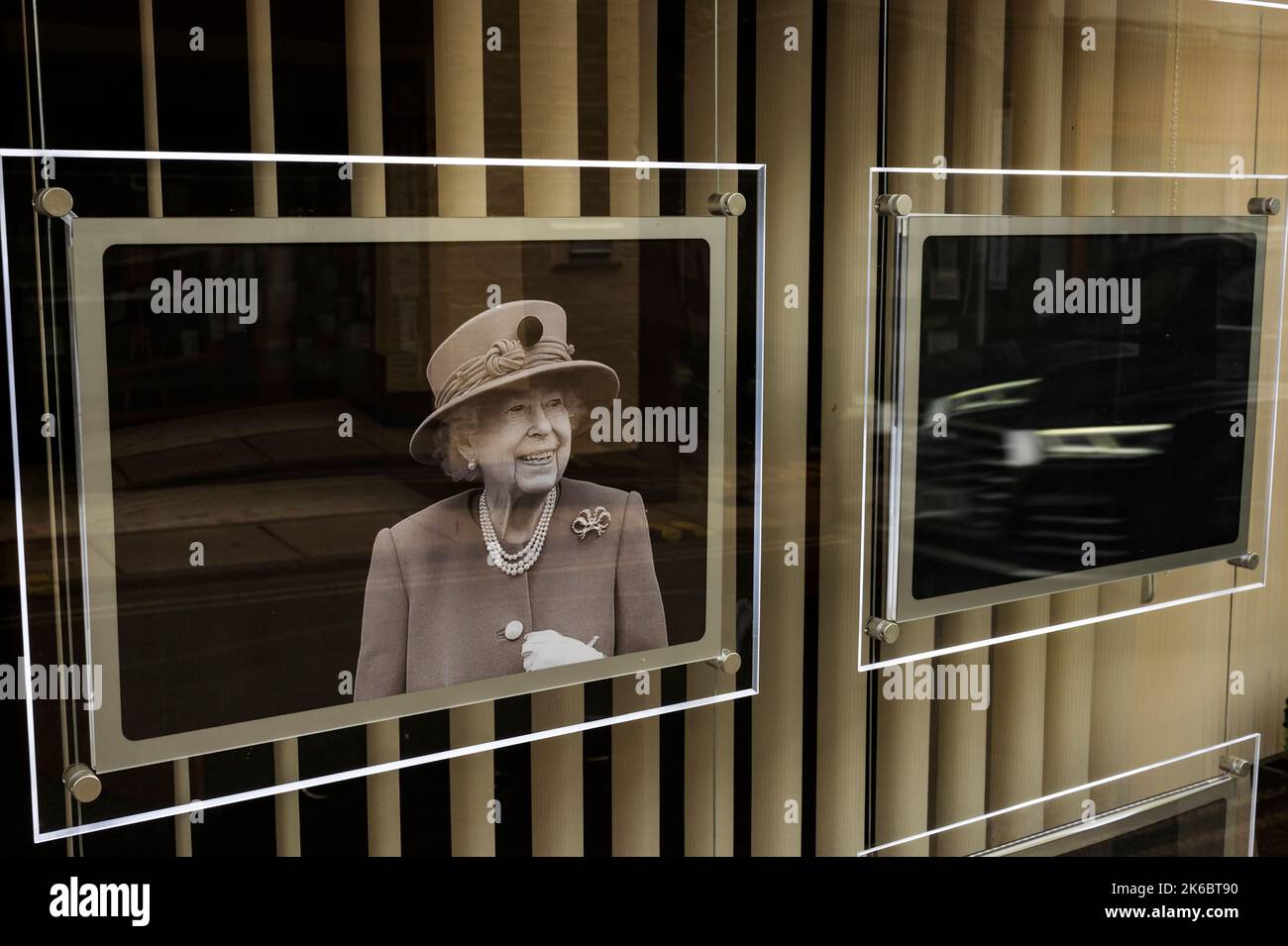 Photographs of Queen Elisabeth 2 displayed in shop windows on the day of her funeral Woodbridge Suffolk England Stock Photo