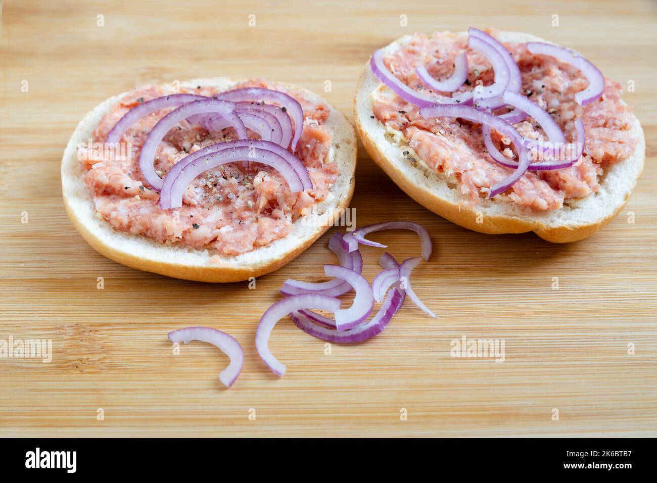 rolls with minced meat and onion rings Stock Photo