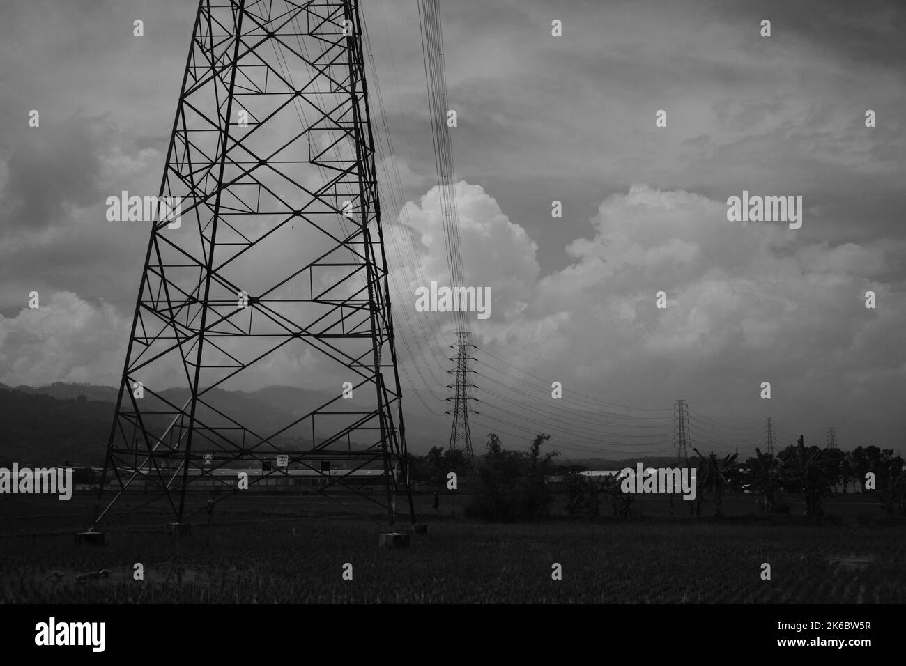 Monochrome photo, view of signal tower and electricity distribution