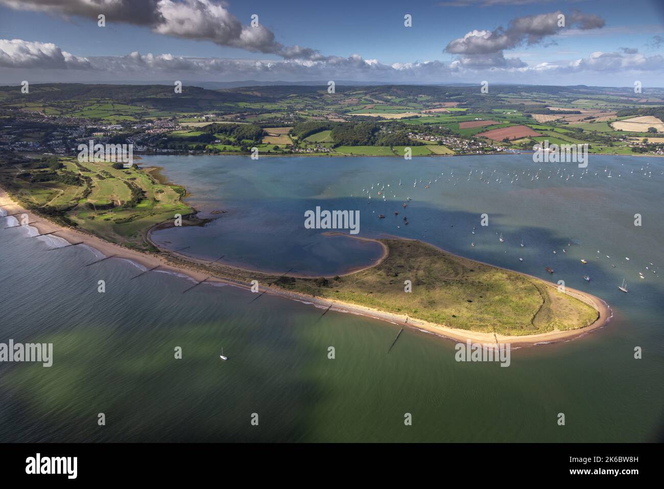 Aerial photograph of Dawlish Warren Spit, located at the mouth of the River Exe with the Devon coastline and Dartmoor in the background. Stock Photo