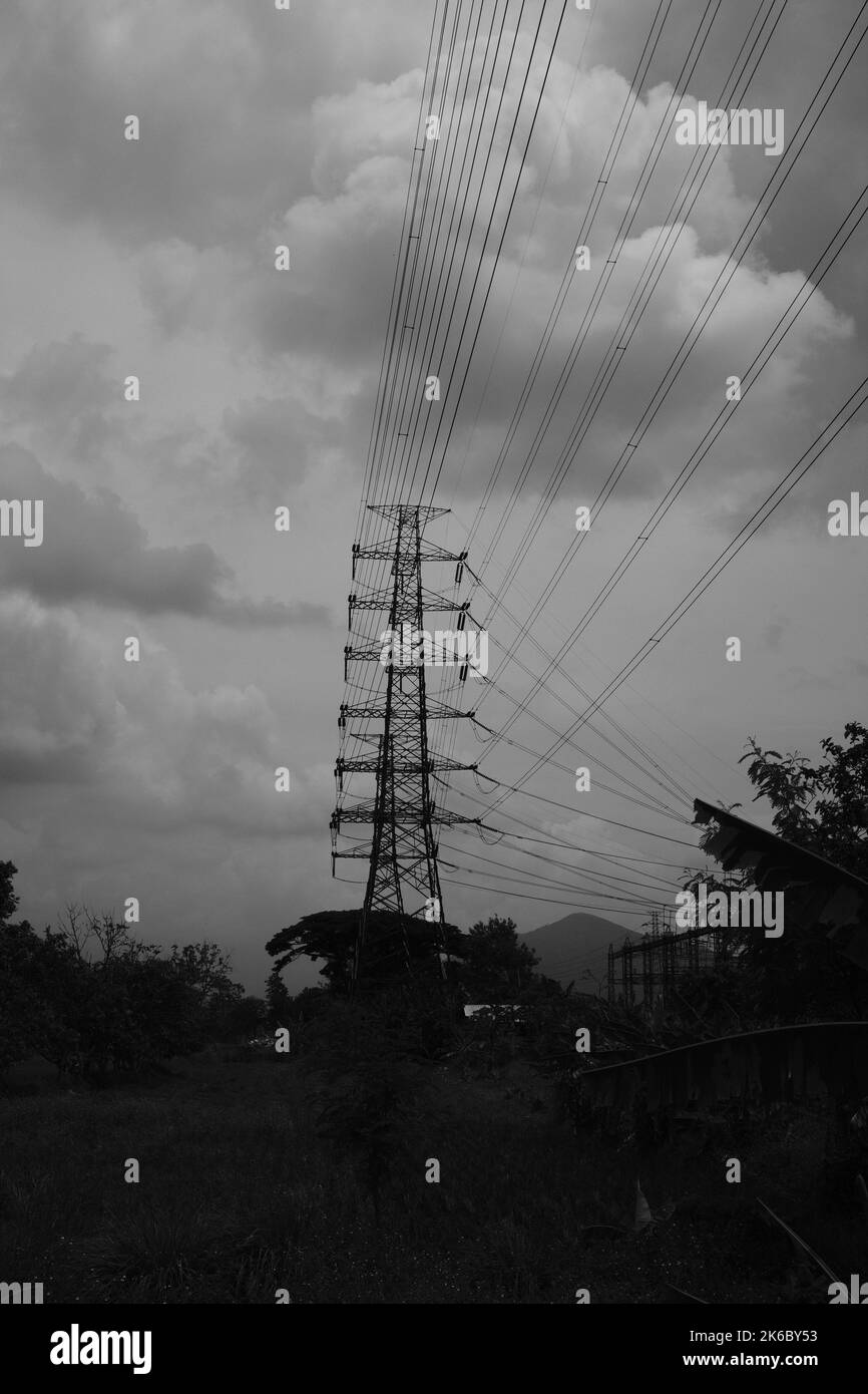 Monochrome photo, view of signal tower and electricity distribution