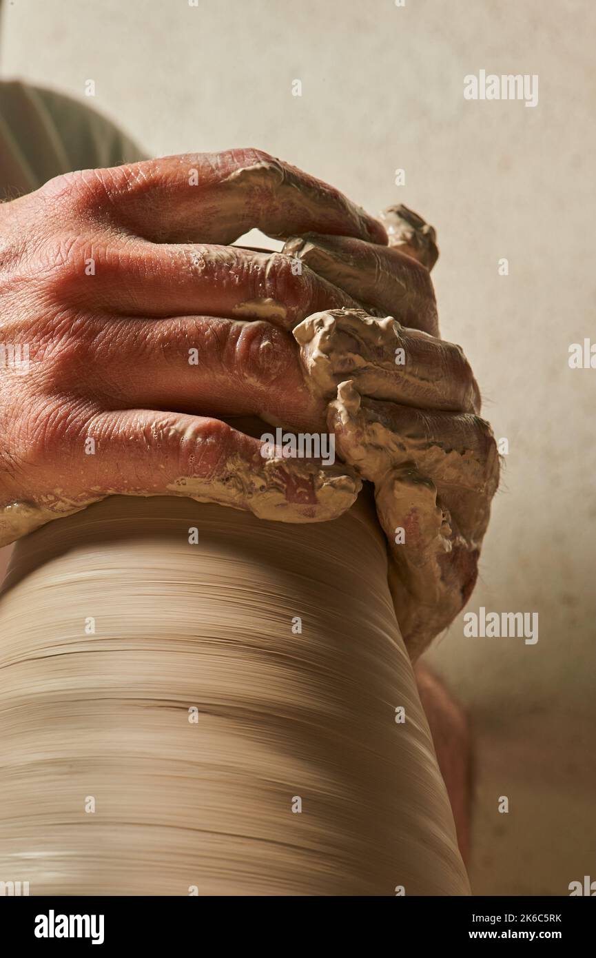 Craftsman molding a clay vase Stock Photo Alamy