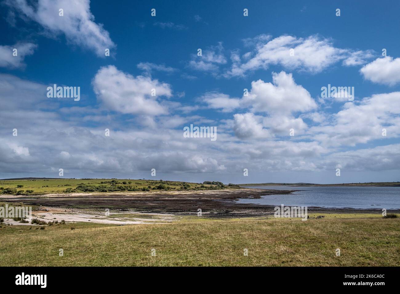 The receding shoreline caused by severe drought conditions at Colliford Lake Reservoir on Bodmin Moor in Cornwall in the UK. Stock Photo