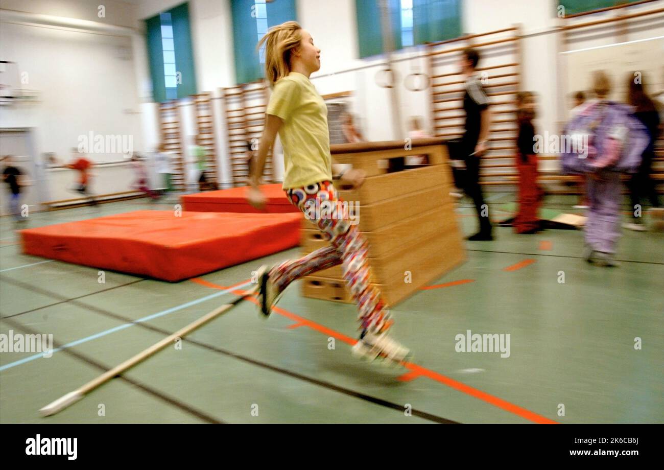 Gymnastics lesson at an elementary school. Stock Photo