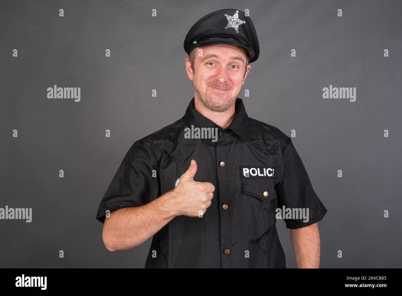 Happy police officer hi-res stock photography and images - Alamy