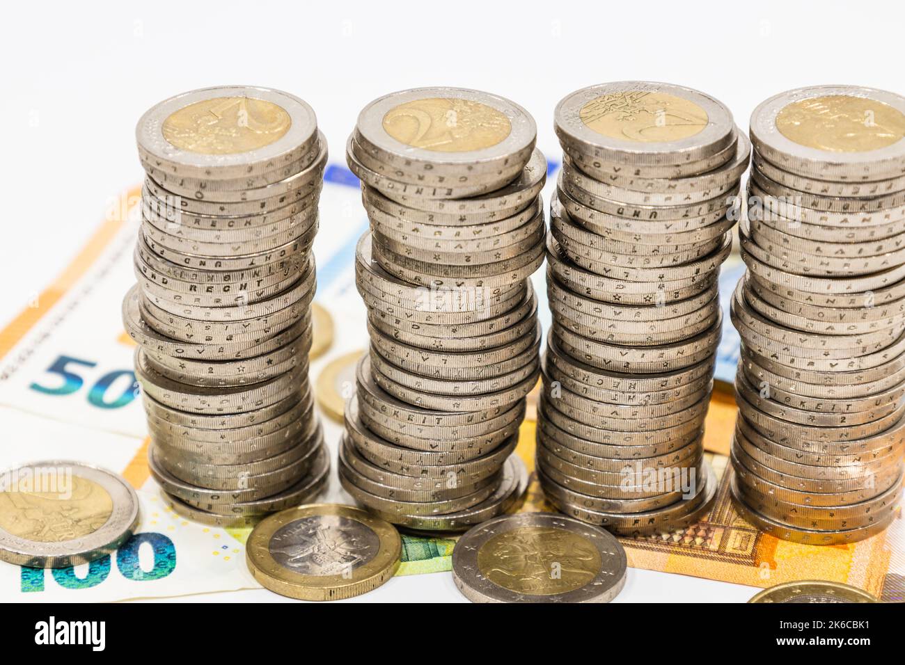 The pile of euro coins on euro notes. Business, wealth, finance, and saving money concept Stock Photo