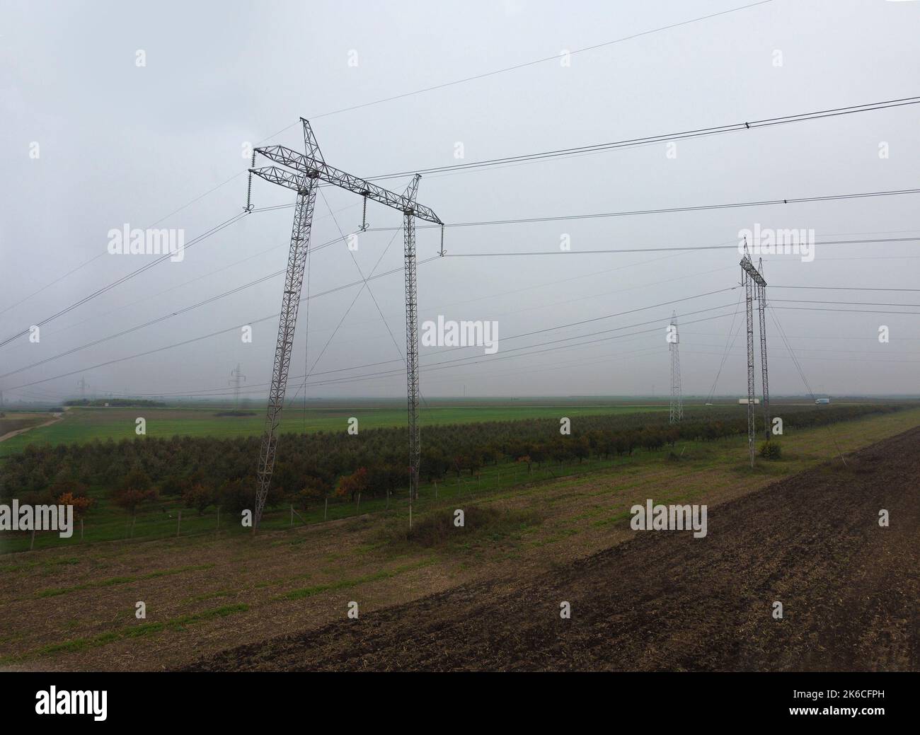 Power lines spreading across the landscape. Energy crisis concept Stock