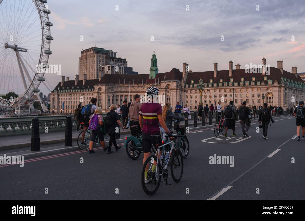 crowds of People Walk in the road over Westminster Bridge taking advantage of the road closure due to Queen lying in state ceremony. Stock Photo