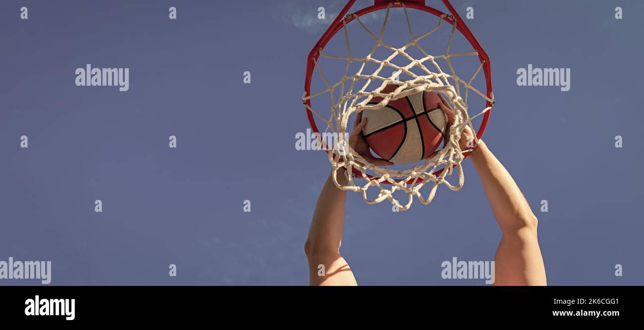 top view of basketball player throws the ball into the hoop outdoor