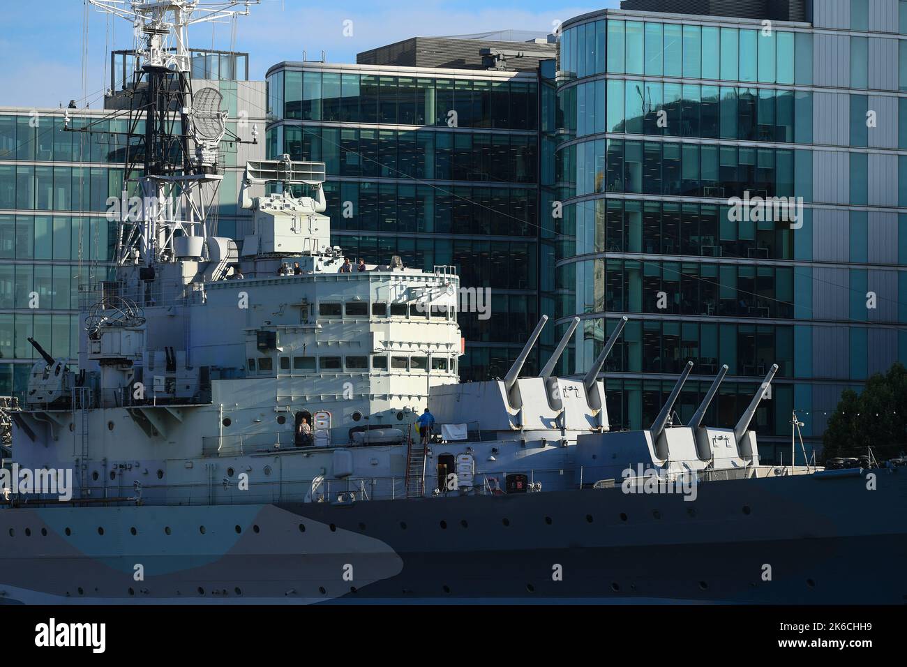 Telephoto lens close-up of HMS Belfast gun deck and bridge with modern ...