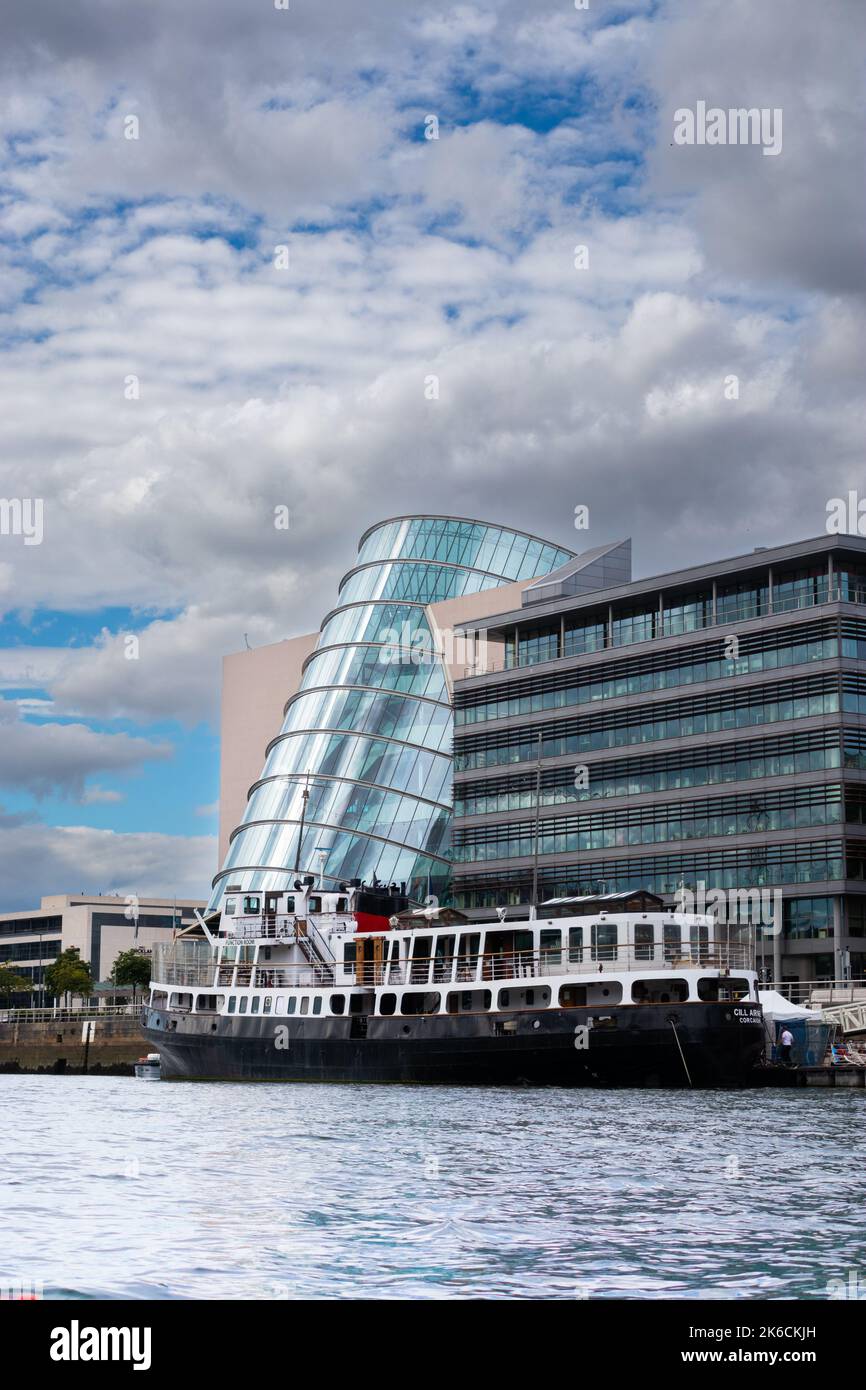 Cill airne Corcaigh Dublin's floating Restaurant and Bar on the River Liffey with curved front of the Convention Centre on the riverfront Stock Photo