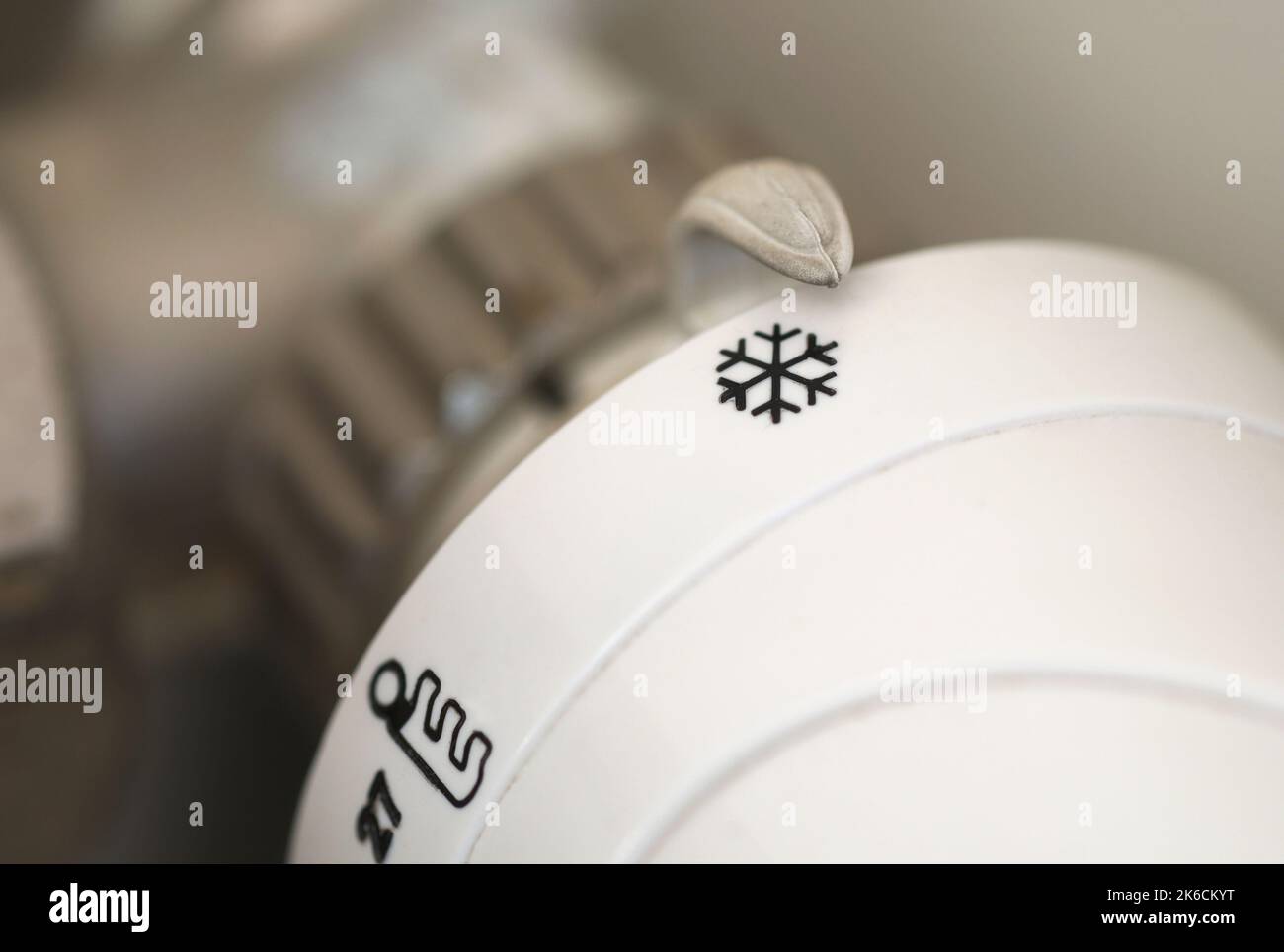 Heating radiator adjusting knob set to cold icon Stock Photo