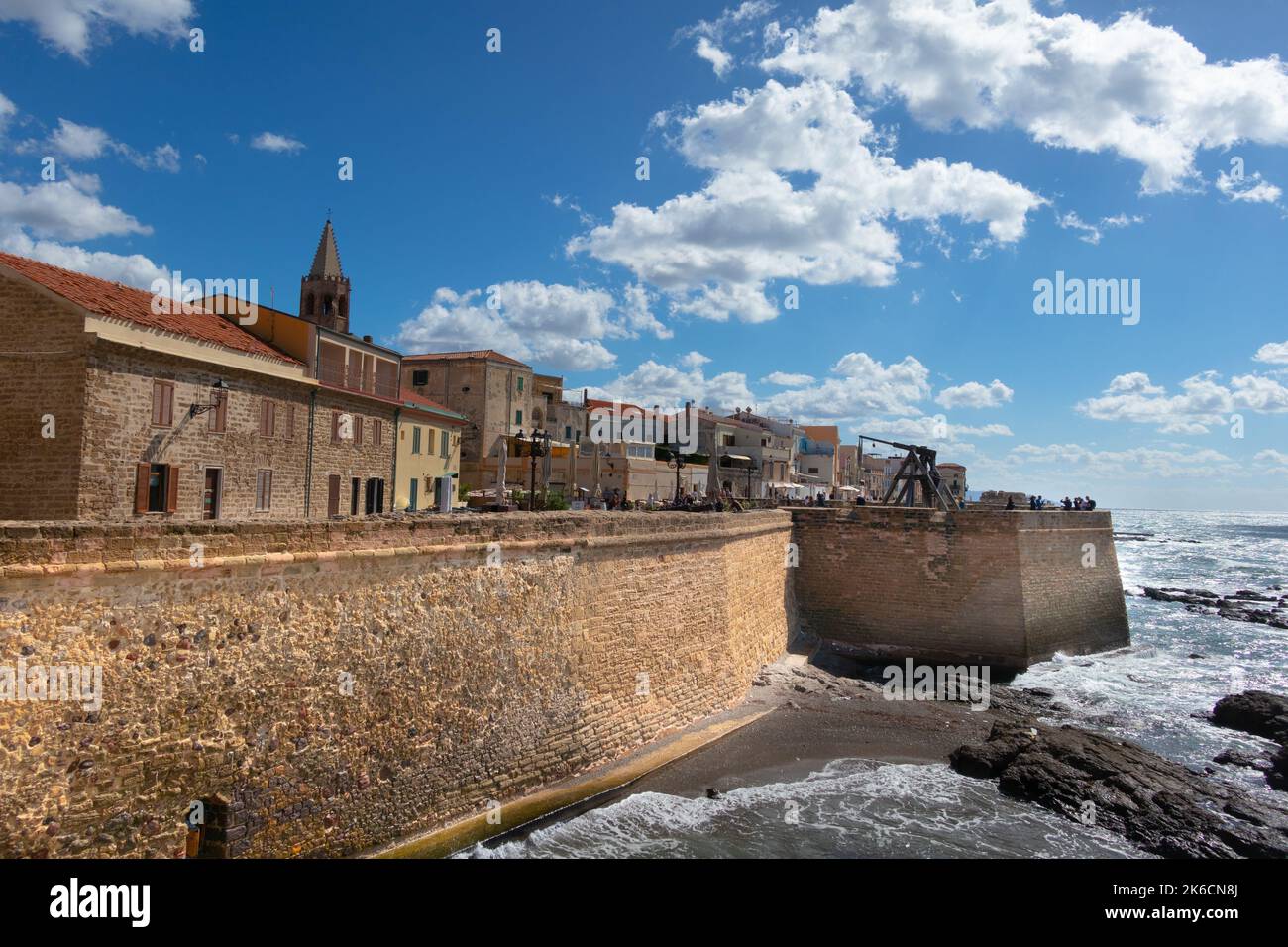 Golden 14th century defensive seawalls at Alghero, north-west Sardinia, Italy Stock Photo