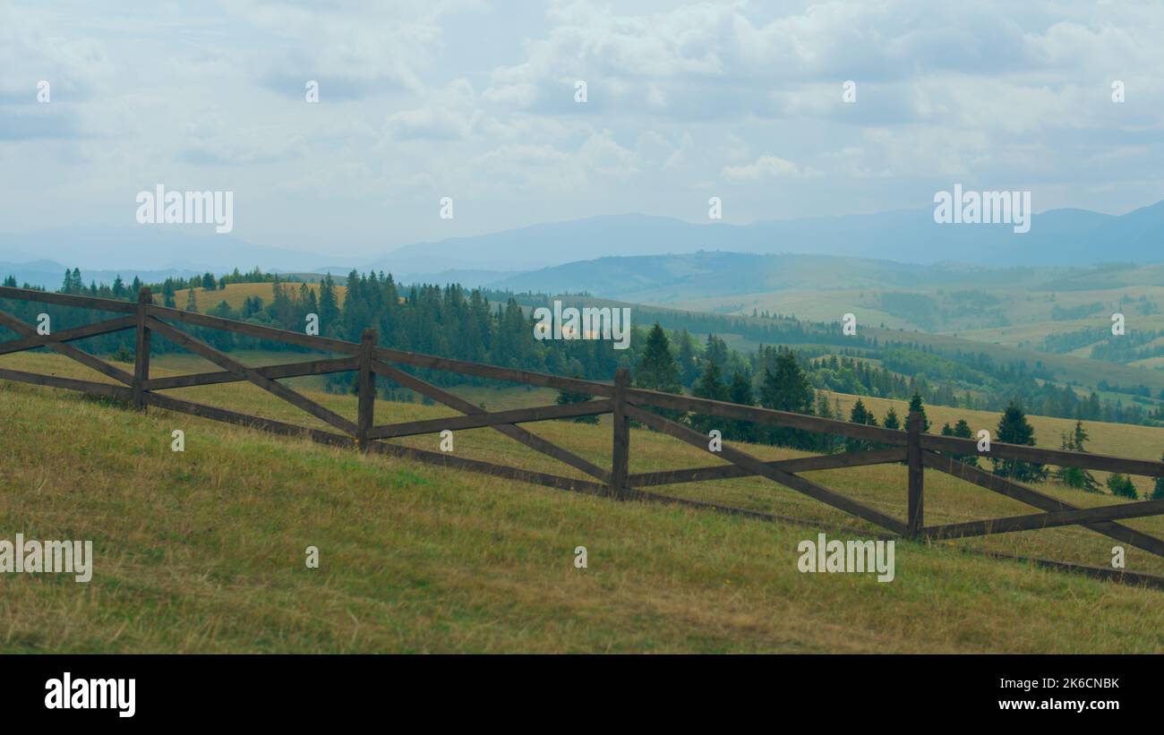 Panorama view on beautiful hills valley between mountains. Aesthetic landscape of clear nature, fresh foggy weather. Amazing view from high rock Stock Photo