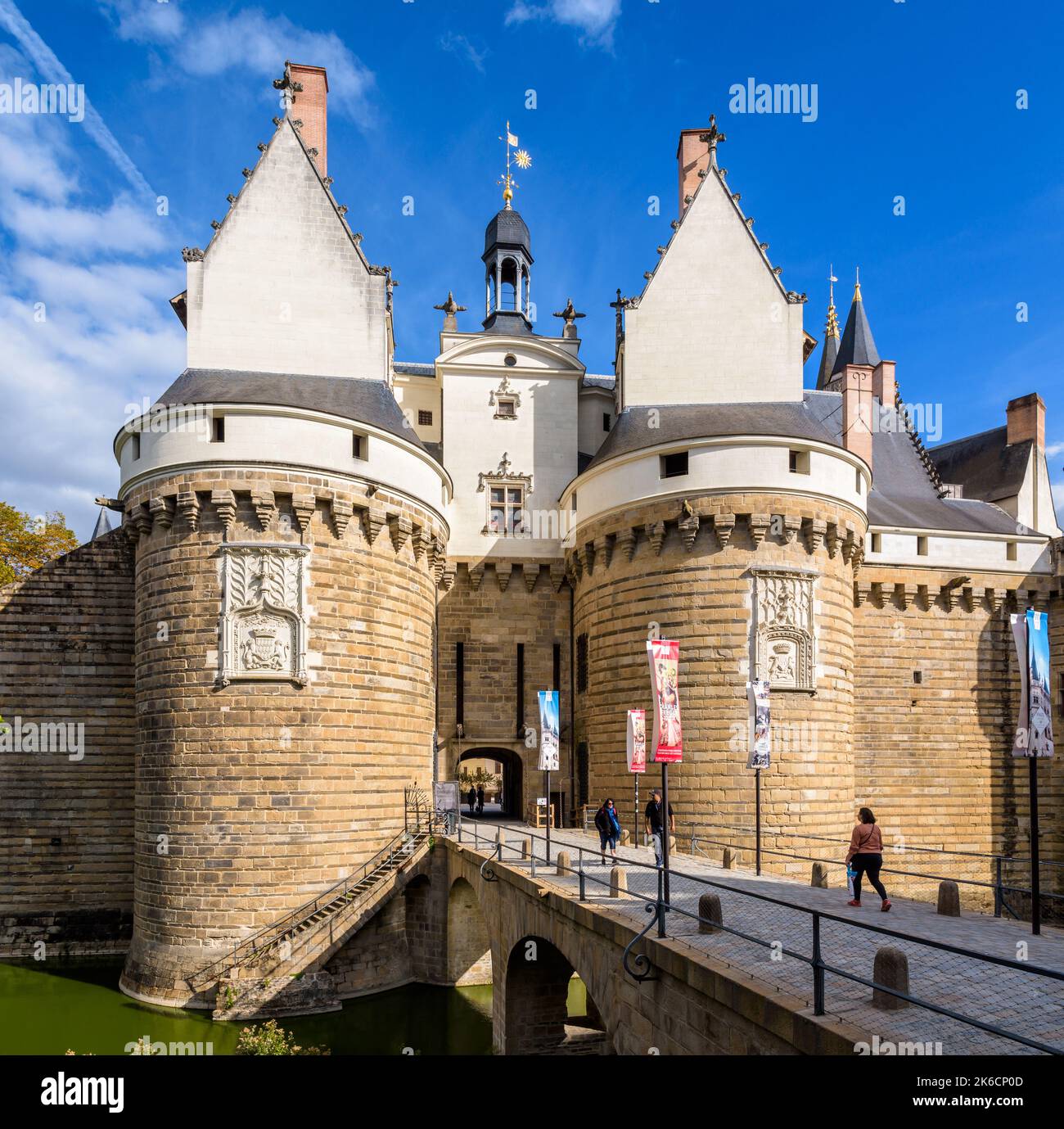 Gatehouse with two towers and stone bridge at the entrance of the ...