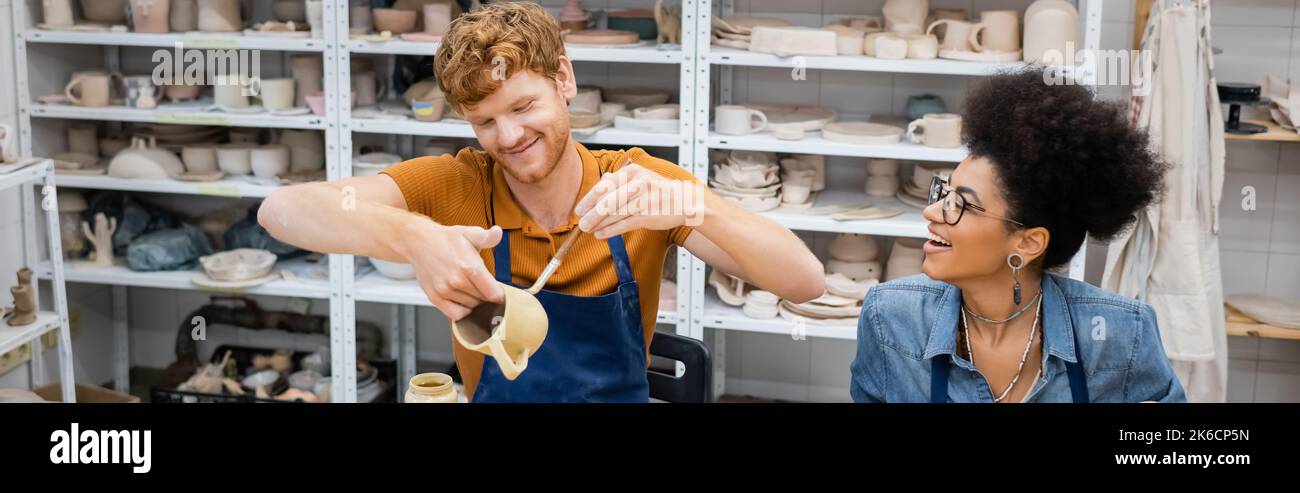 Smiling redhead man painting hi-res stock photography and images - Alamy
