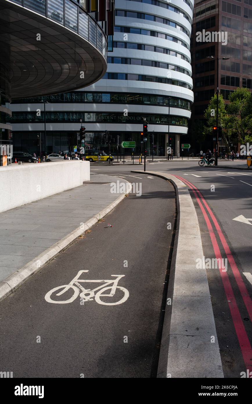 London protected Cycle lane leading from Westminster Bridge Road to Park Plaza and DLD College London Roundabout. London UK. Stock Photo