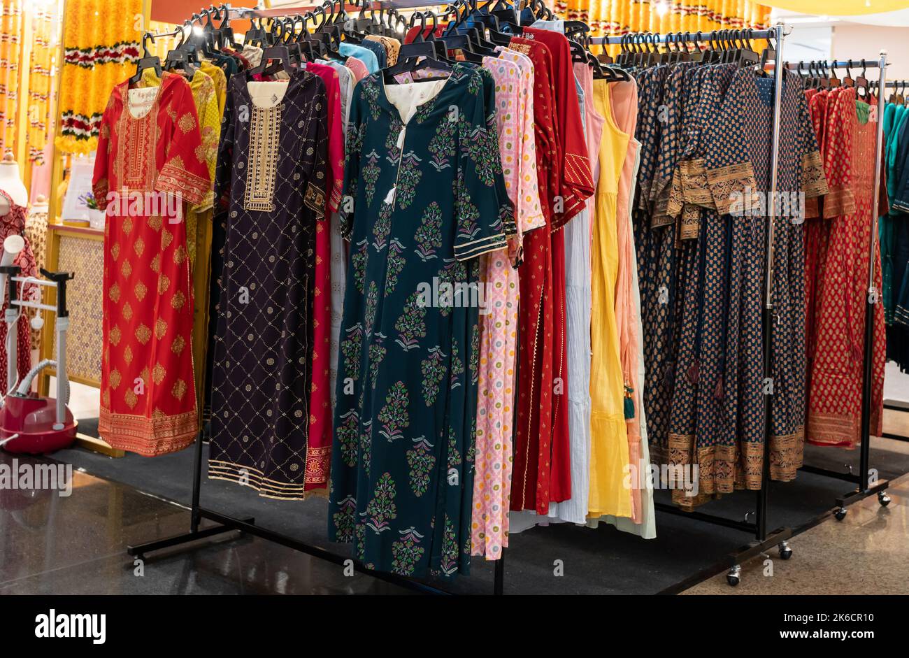 Various types of Indian fashion clothes displaying and selling in the shopping mall. Stock Photo