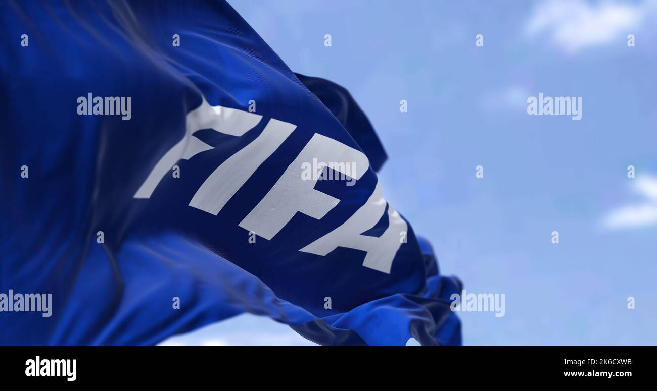 Zurich, SWI, October 2022: Close-up view of the Fifa flag waving in the wind. Fifa is an international governing body of association football, beach f Stock Photo