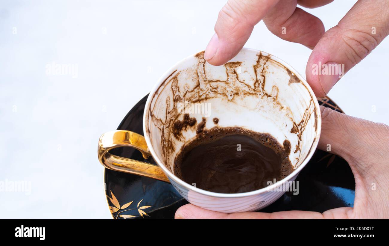 Fortune telling with coffee. Woman fortune teller predicting the future