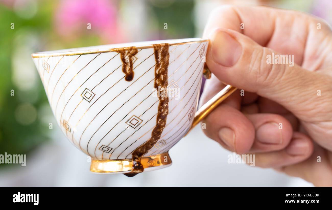 Fortune telling with coffee. Woman fortune teller predicting the future