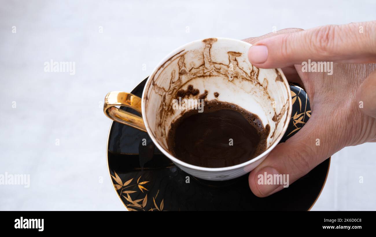 Fortune telling with coffee. Woman fortune teller predicting the future