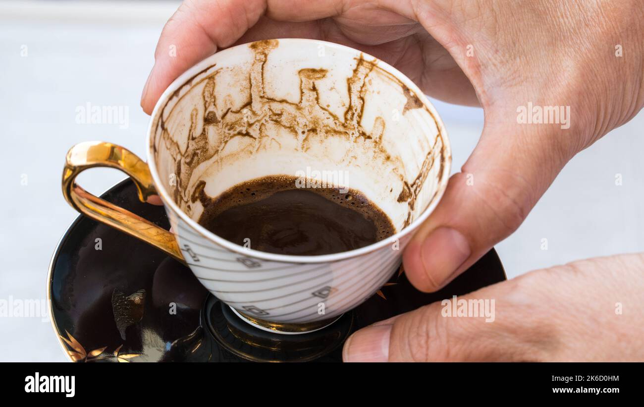 Fortune telling with coffee. Woman fortune teller predicting the future