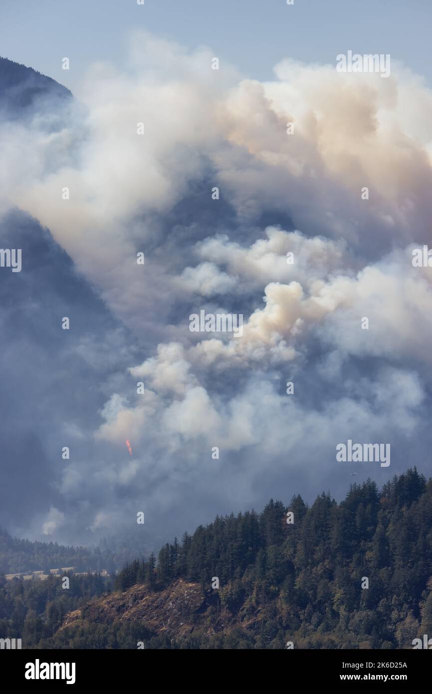 BC Forest Fire and Smoke over the mountain near Hope during a hot sunny ...
