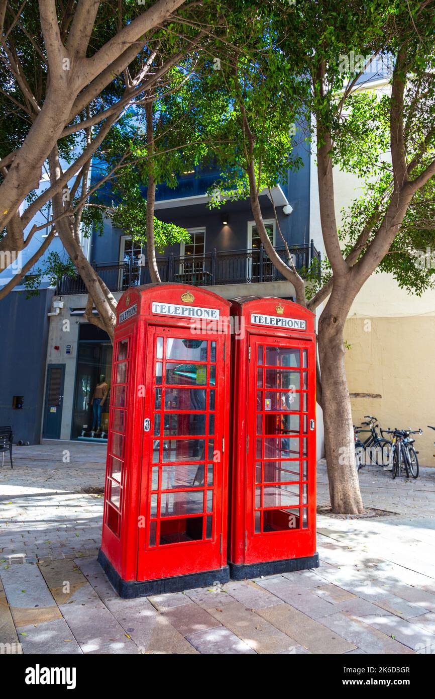 Red K6 British style telephone boxes on the Main Street of Gibraltar Stock Photo